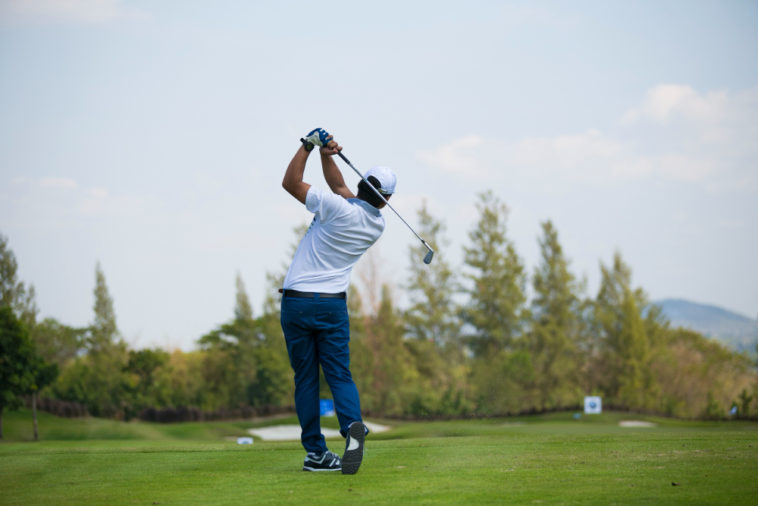 Man playing golf, but it could cost him