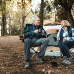 Senior couple enjoy their retirement camping in a park