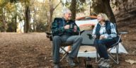 Senior couple enjoy their retirement camping in a park