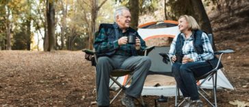 Senior couple enjoy their retirement camping in a park