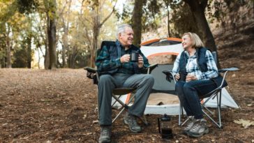 Senior couple enjoy their retirement camping in a park