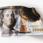 Utterly damaged hundred dollar bill
