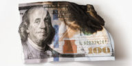 Utterly damaged hundred dollar bill
