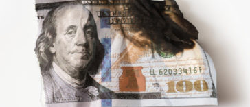 Utterly damaged hundred dollar bill