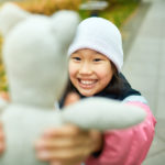 Child with valuable beanie baby toy