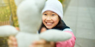 Child with valuable beanie baby toy