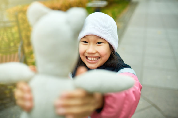 Child with valuable beanie baby toy