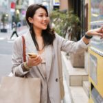 Woman using weird vending machine in Japan