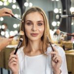 Wealthy woman having expensive makeup applied to her face