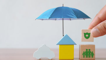 wooden house under an umbrella