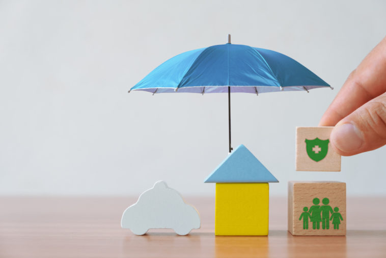 wooden house under an umbrella