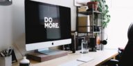 computer on desk with do more written onscreen