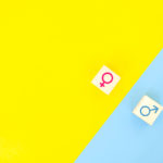 female and male gender symbols on top of yellow and blue background