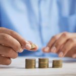 man counting coins