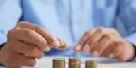 man counting coins