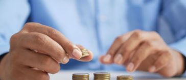 man counting coins