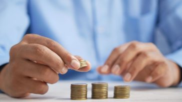 man counting coins