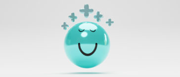 blue smiley face with plus signs above it