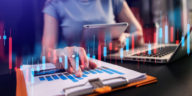 woman working in a modern office with a graph indicator