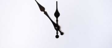 black clock hands on a white background