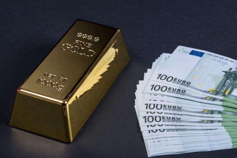 a gold bar and a stack of euros