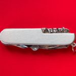 swiss army knife on a red background