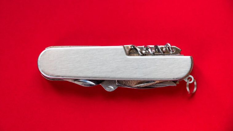 swiss army knife on a red background