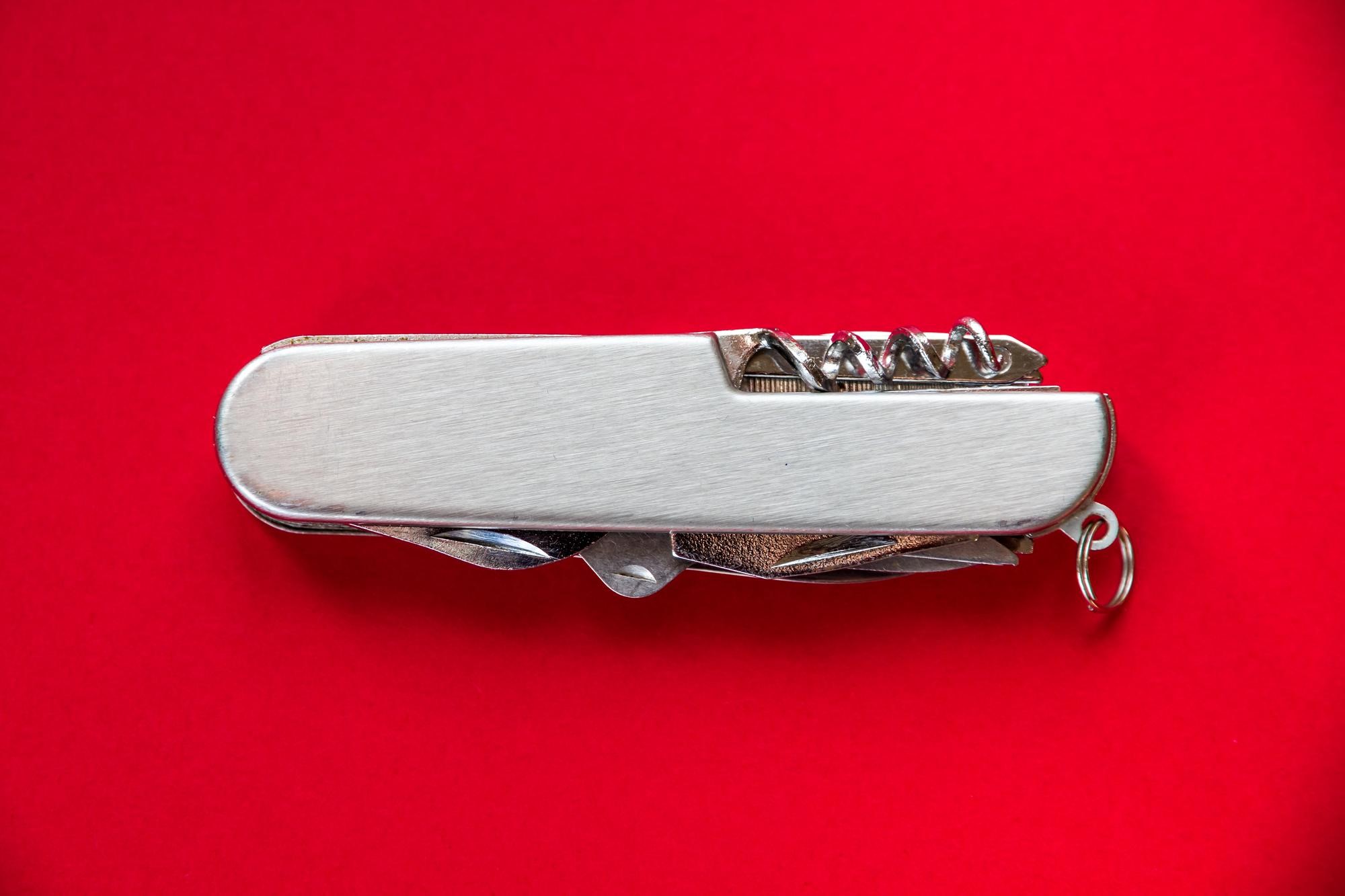 swiss army knife on a red background