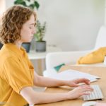 woman working on a computer at a desk