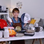 woman showing clay ceramic products