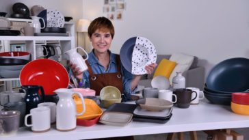 woman showing clay ceramic products