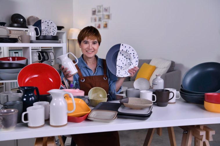 woman showing clay ceramic products
