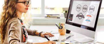 woman working on designing logos on a computer