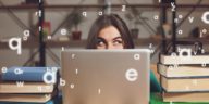 woman showing only her eyes looking out her laptop
