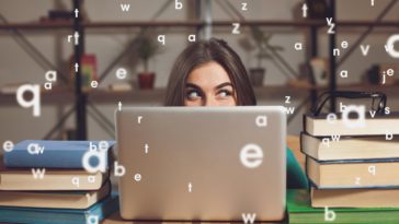 woman showing only her eyes looking out her laptop