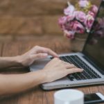 woman hands typing on a laptop