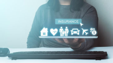 woman holding a tablet with 3d insurance icons above it