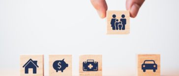 wooden blocks with insurance icons