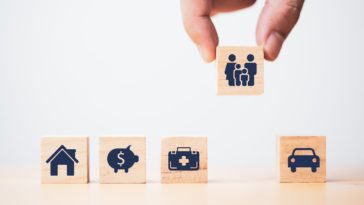 wooden blocks with insurance icons