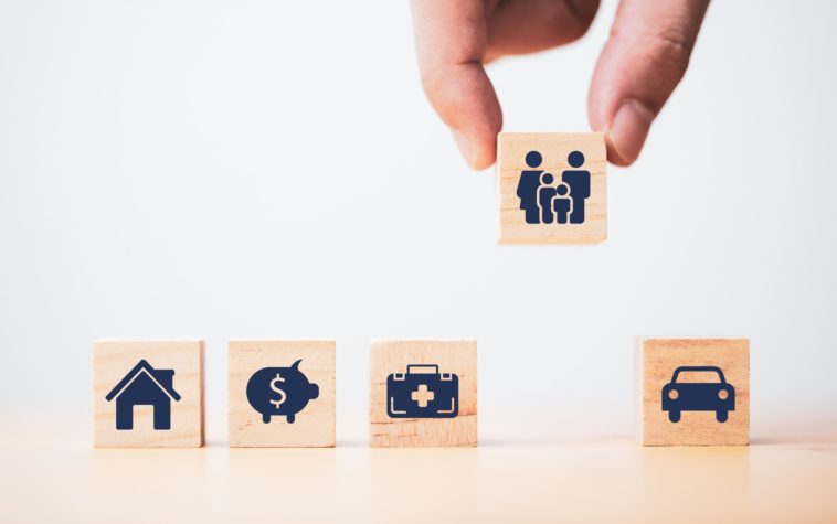 wooden blocks with insurance icons