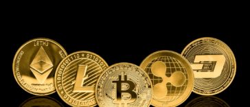 gold cryptocurrency coins with a black background