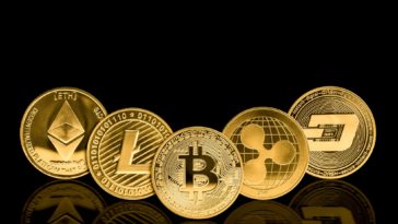 gold cryptocurrency coins with a black background