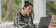 young girl using a laptop at home