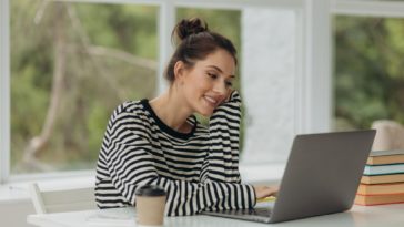 young girl using a laptop at home