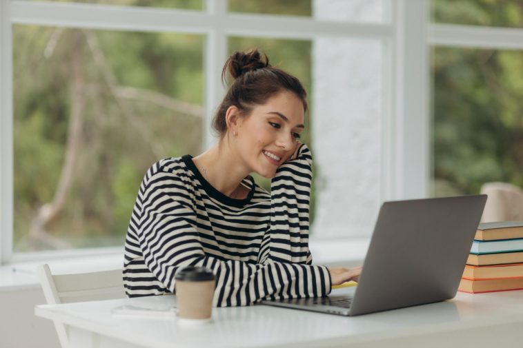 young girl using a laptop at home