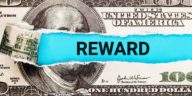 hundred dollar bill with reward written in the middle
