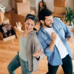 Couple having fun while moving