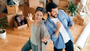 Couple having fun while moving