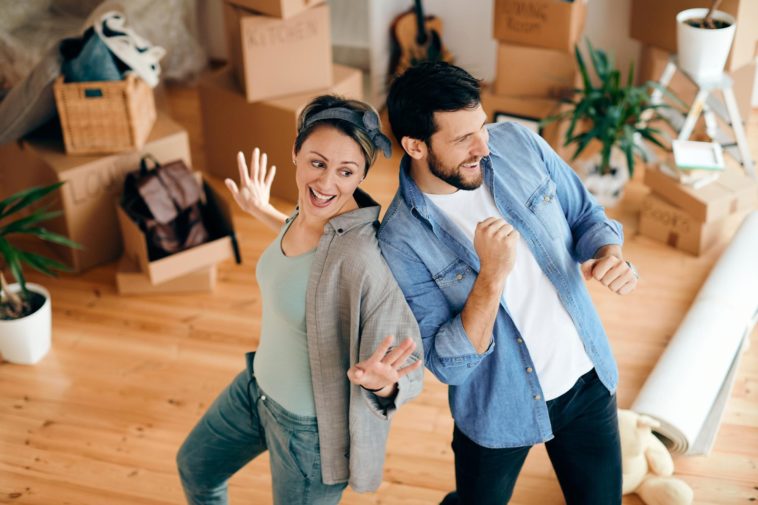 Couple having fun while moving