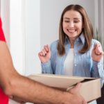 excited woman receiving a package delivery